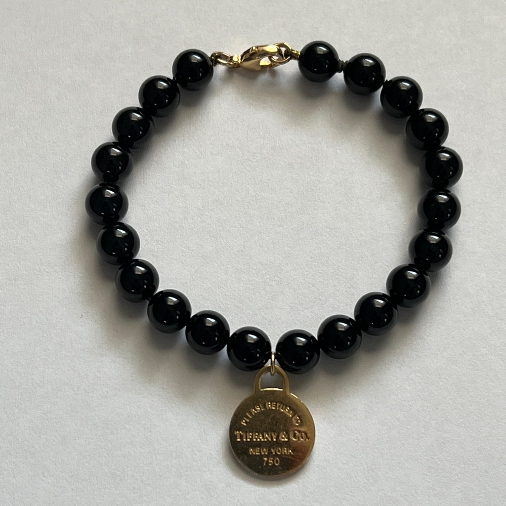 Tiffany & Co. Black Bead Bracelet with round Gold Charm